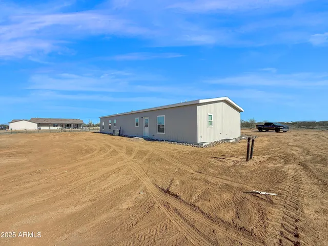 a view of house with yard