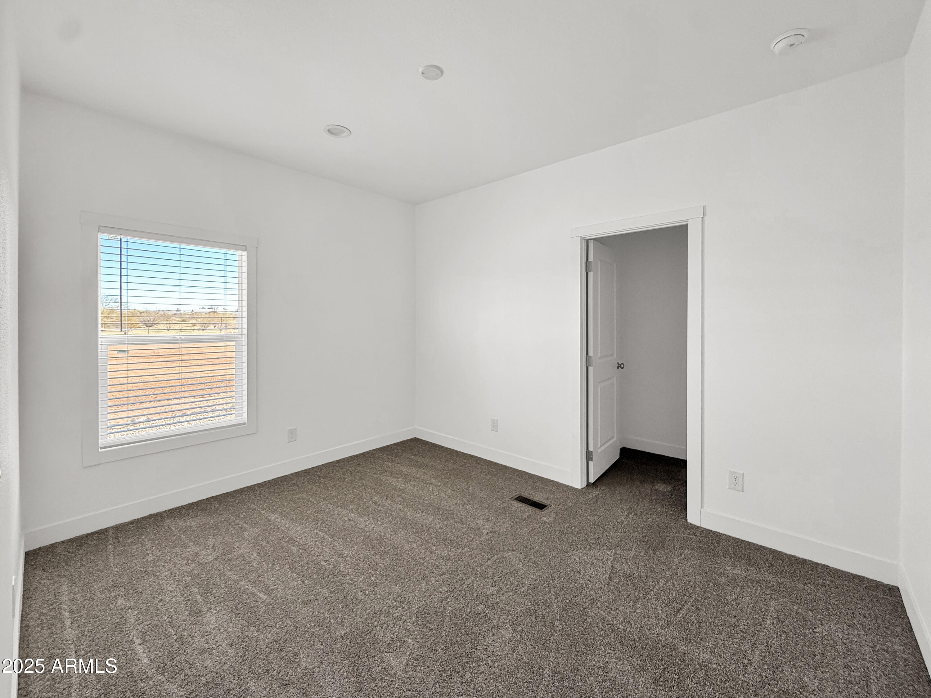 8548 North Page Road Florence, AZ 85132 - Photo 9 of 23 an empty room with a window
