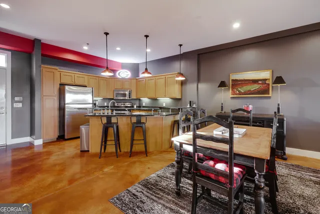 a living room with furniture a rug and a projector