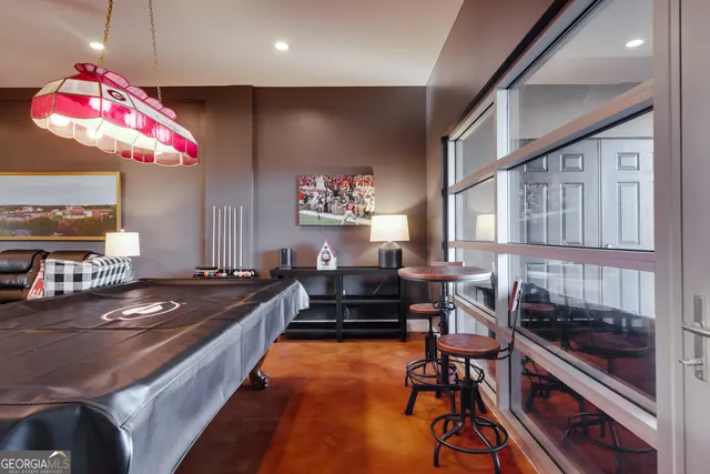 a view of a balcony dining table and chairs