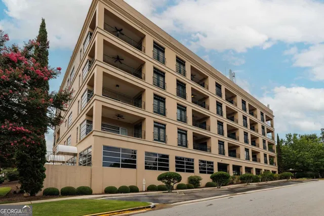 an aerial view of a building with an outdoor space