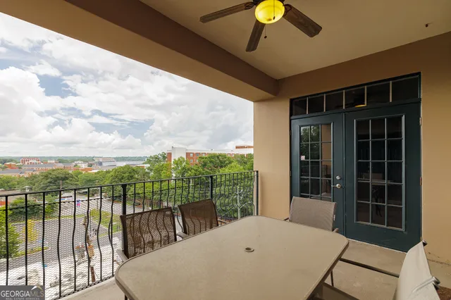 a large kitchen with a table and chairs