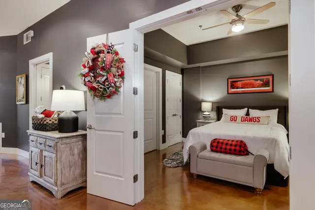 a bedroom with a bed and a lamp