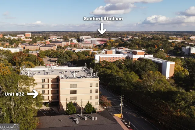 a kitchen with stainless steel appliances granite countertop a refrigerator a sink and a stove