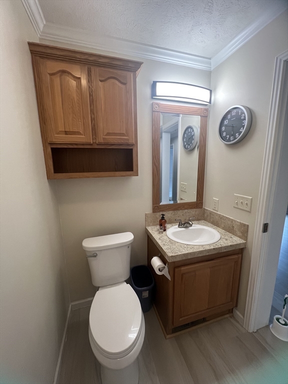 55 Hillview Drive West Springfield, MA 01089 - Photo 15 of 26 a bathroom with a toilet a sink and mirror