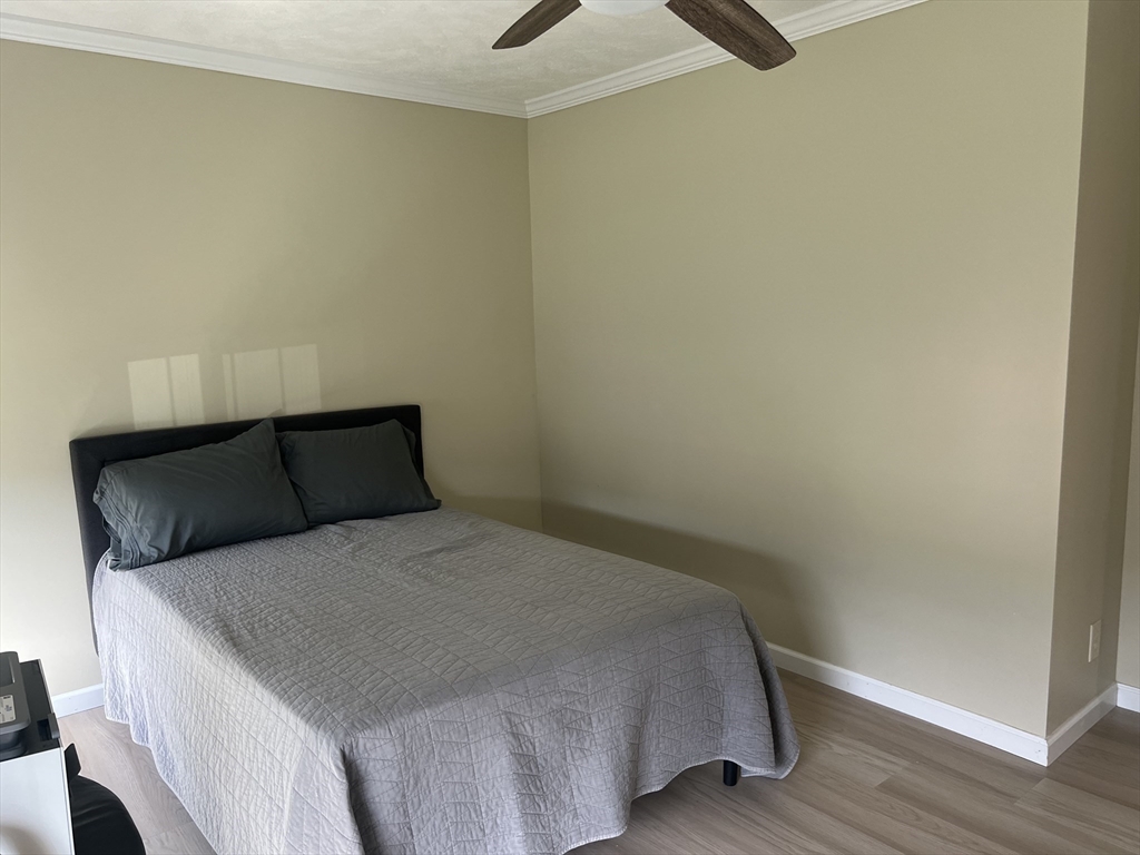 55 Hillview Drive West Springfield, MA 01089 - Photo 18 of 26 a bedroom with a bed and wooden floor