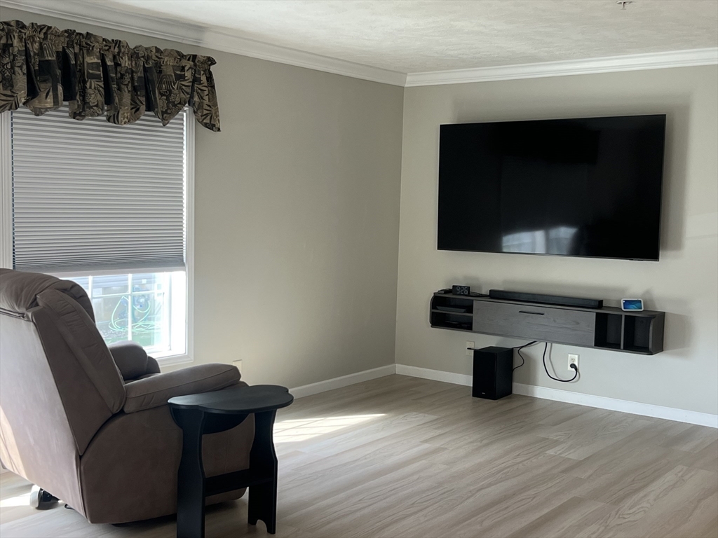 55 Hillview Drive West Springfield, MA 01089 - Photo 4 of 26 a living room with furniture and a flat screen tv