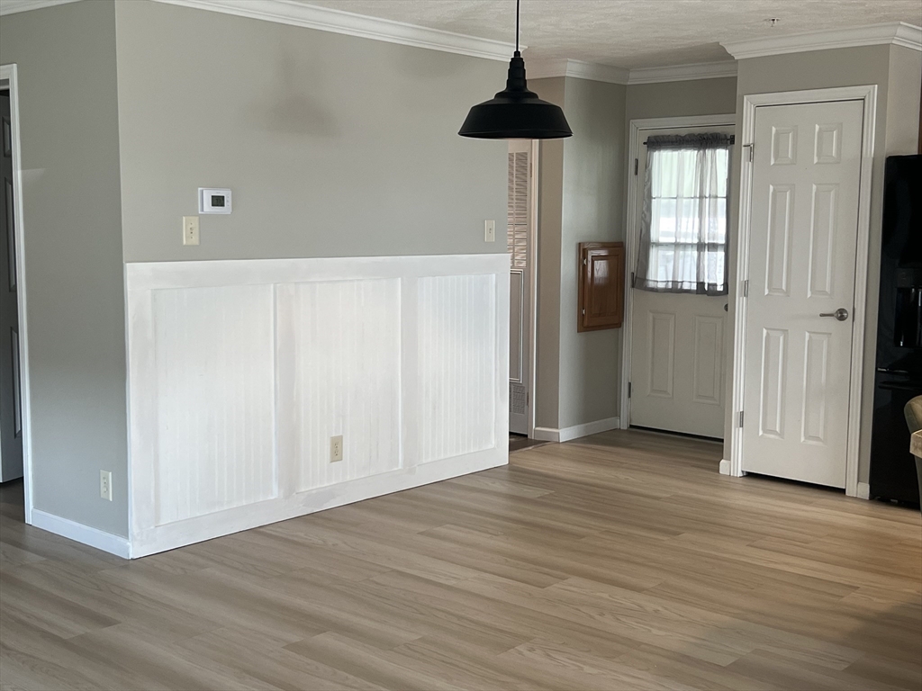 55 Hillview Drive West Springfield, MA 01089 - Photo 7 of 26 a view of an empty room with wooden floor and windows