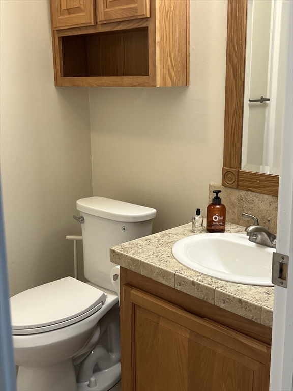 55 Hillview Drive West Springfield, MA 01089 - Photo 8 of 26 a bathroom with a sink a toilet and a mirror