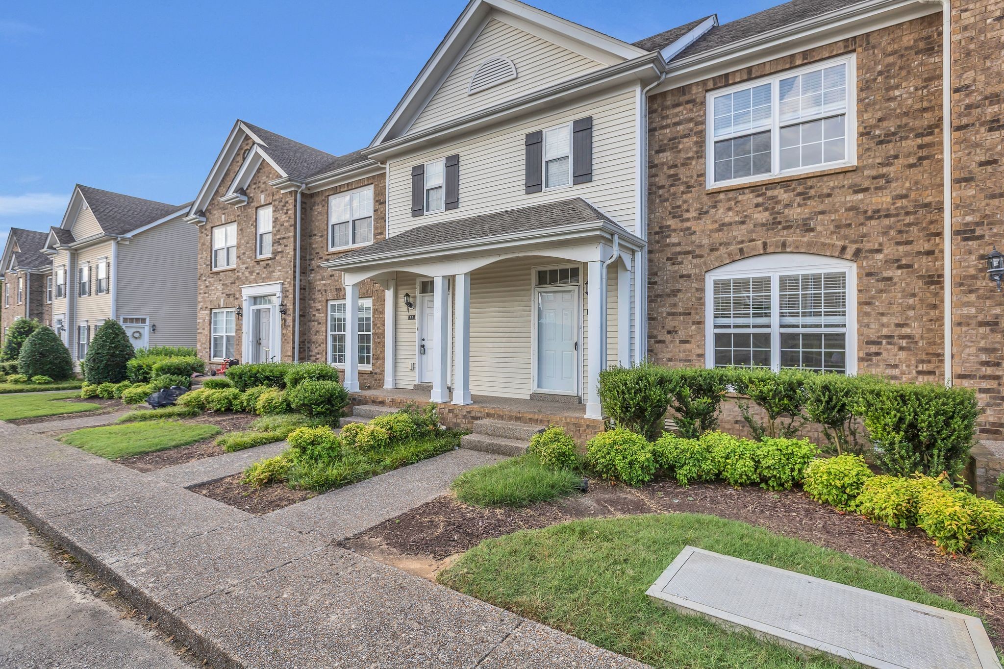 2271 Dewey Drive, Unit J3 Spring Hill, TN 37174 - Photo 1 of 31 front view of a brick house with a yard