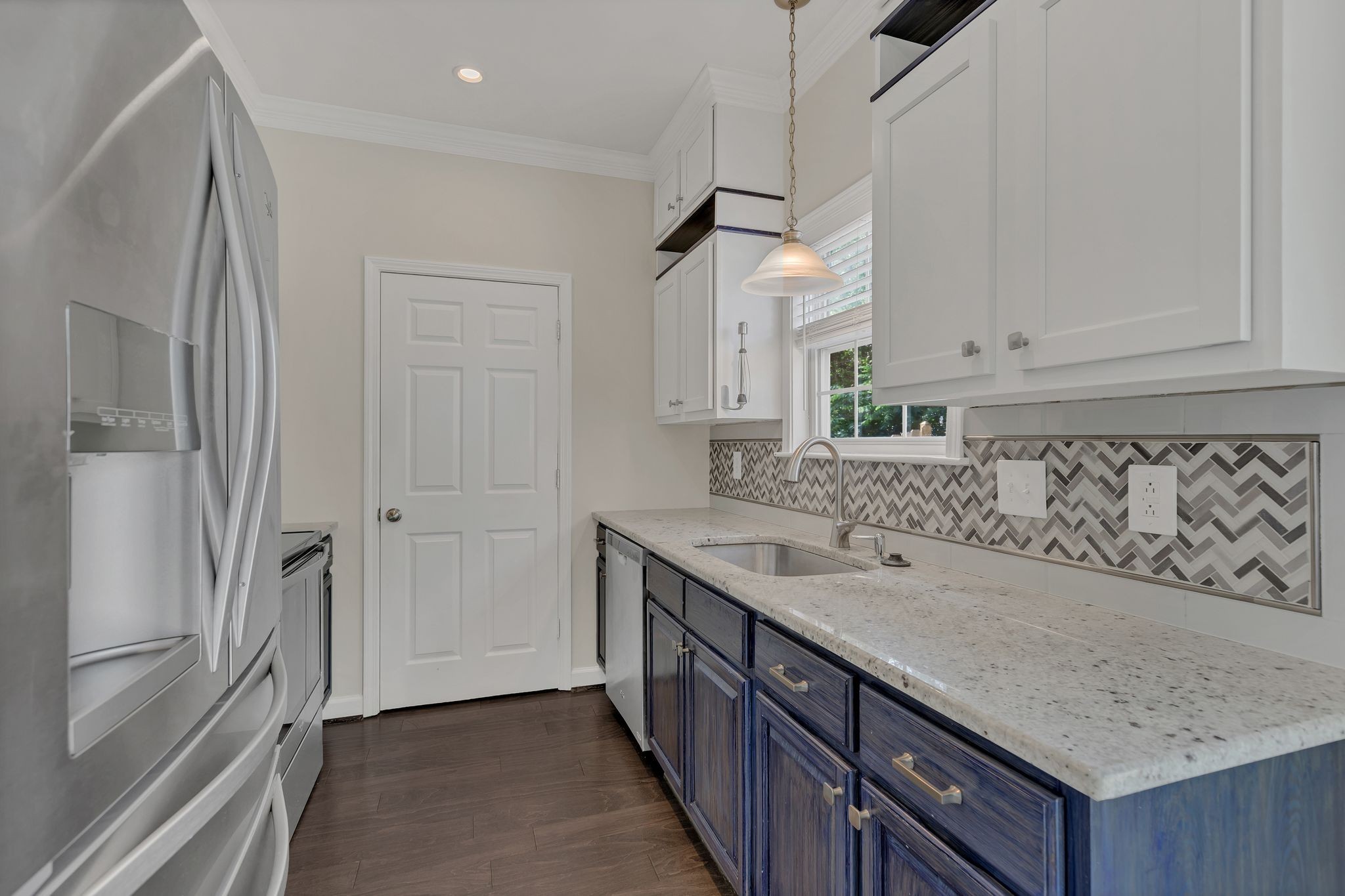 2271 Dewey Drive, Unit J3 Spring Hill, TN 37174 - Photo 12 of 31 a kitchen with a sink and a refrigerator