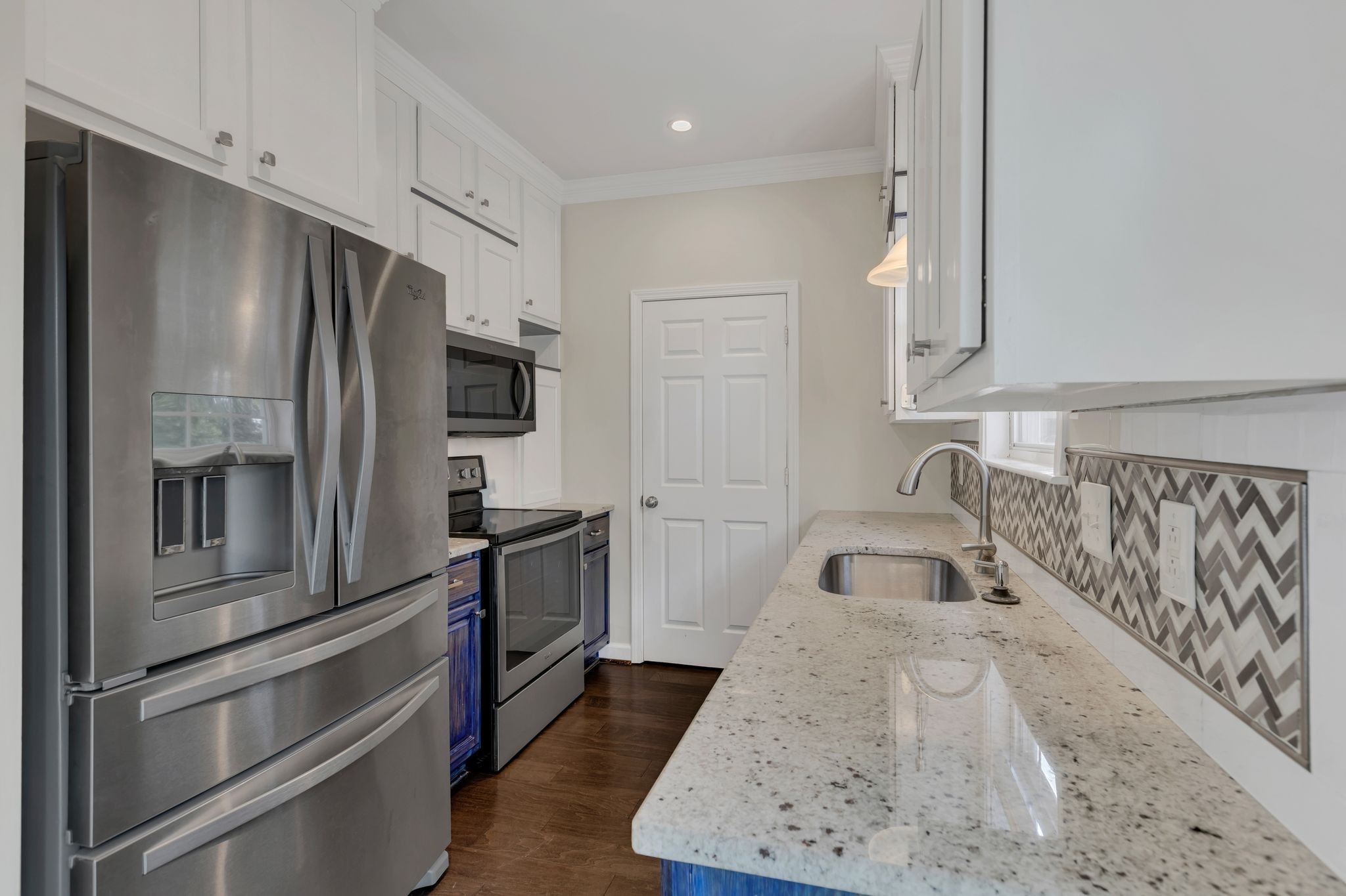 2271 Dewey Drive, Unit J3 Spring Hill, TN 37174 - Photo 13 of 31 a kitchen with stainless steel appliances granite countertop a refrigerator and a sink