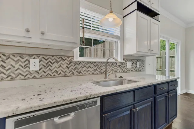 a kitchen with a sink and cabinets