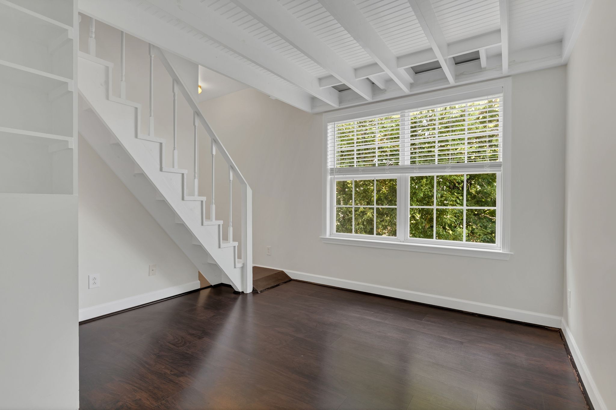 2271 Dewey Drive, Unit J3 Spring Hill, TN 37174 - Photo 22 of 31 a view of an empty room with wooden floor and a window
