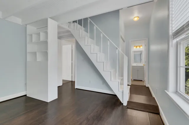 a view of entryway with wooden floor