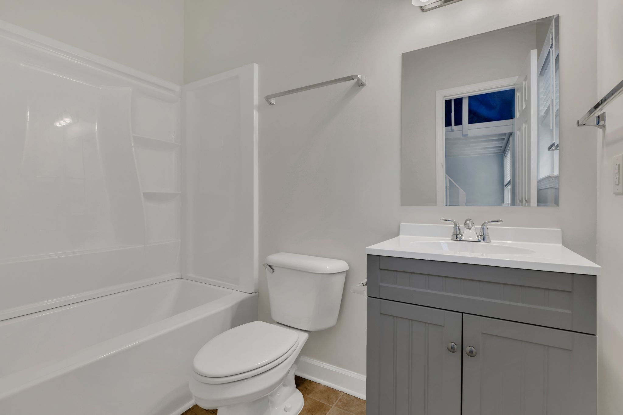 2271 Dewey Drive, Unit J3 Spring Hill, TN 37174 - Photo 24 of 31 a bathroom with a granite countertop toilet a sink and a bathtub