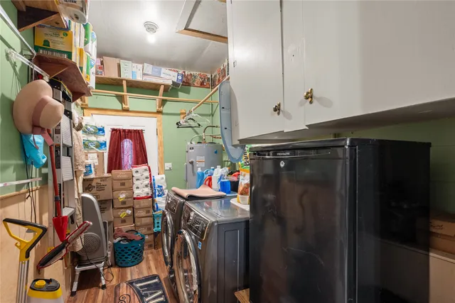 a view of a livingroom with furniture and a flat screen tv