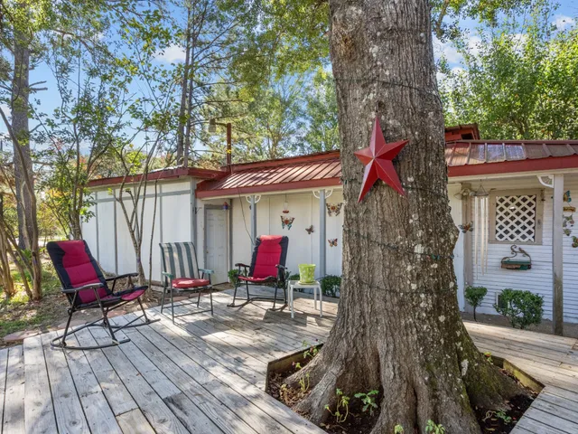 a view of a house with swimming pool and sitting area