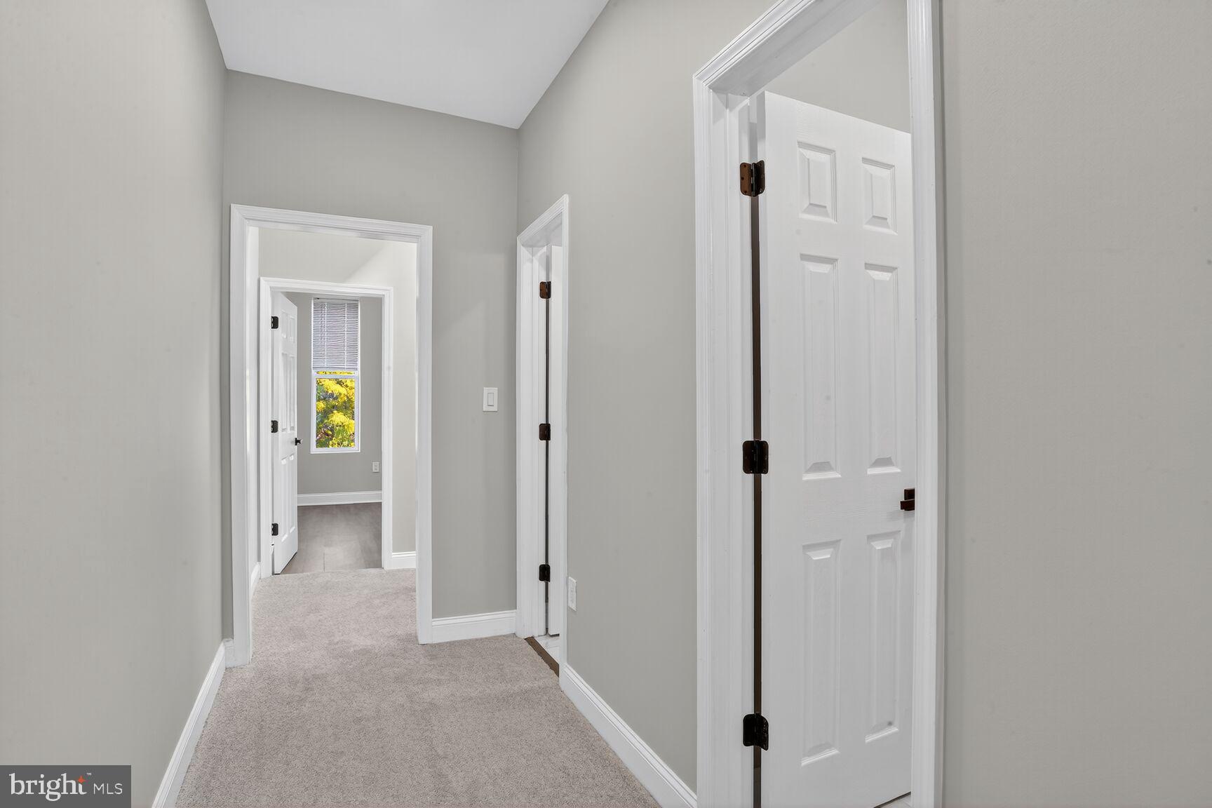 1108 South Carey Street Baltimore, MD 21223 - Photo 18 of 24 a view of a hallway with wooden floor and closet