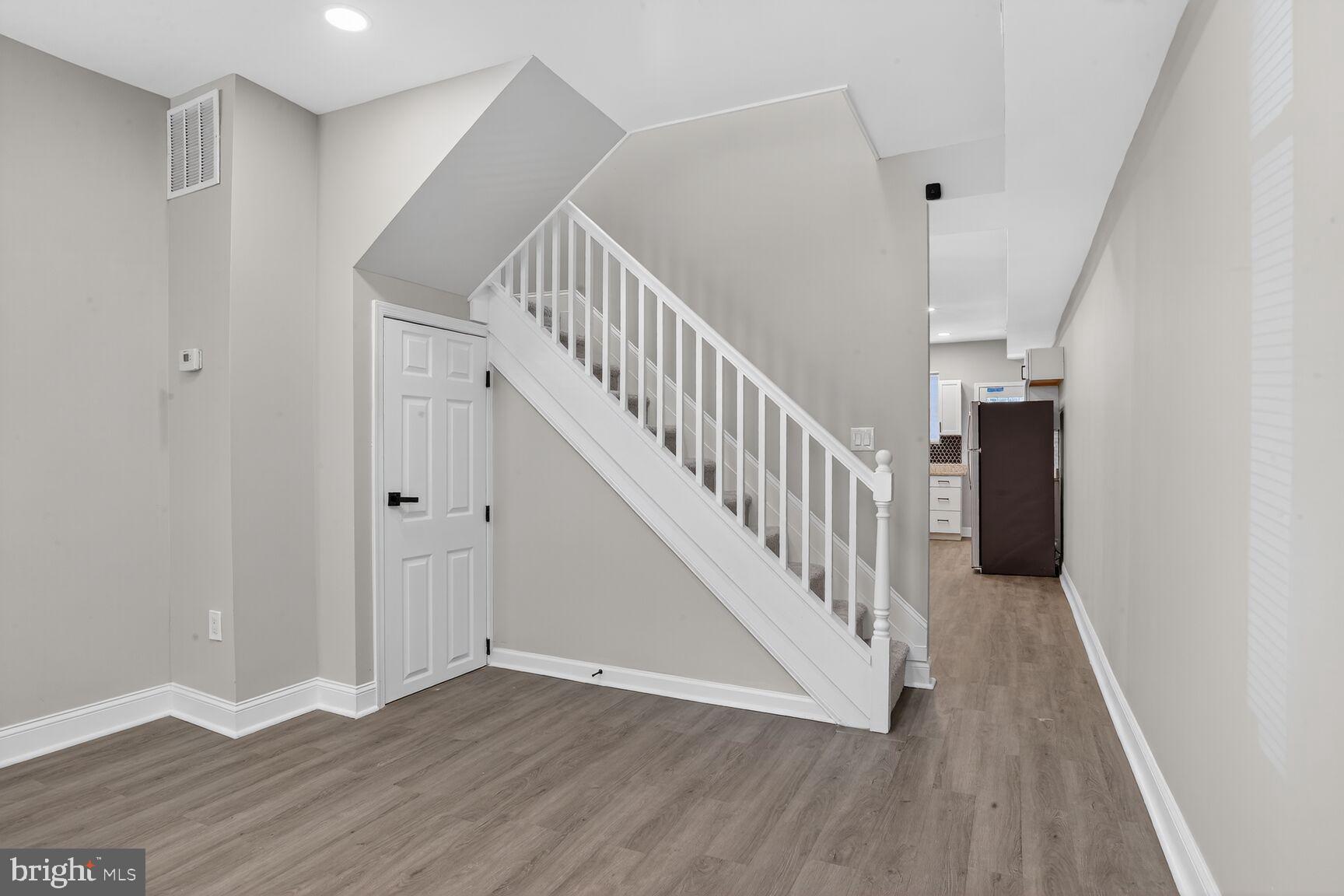 1108 South Carey Street Baltimore, MD 21223 - Photo 4 of 24 a view of entryway with wooden floor