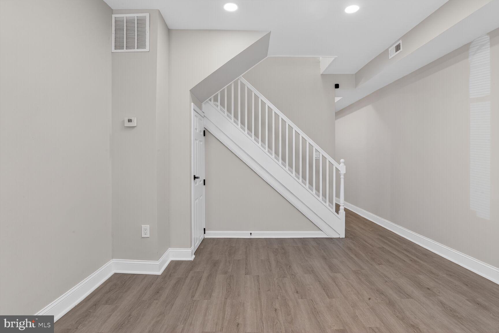 1108 South Carey Street Baltimore, MD 21223 - Photo 5 of 24 a view of entryway with wooden floor