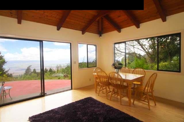 333 Middle Road Kula, HI 96790 - Photo 22 of 25 a view of a patio with table and chairs under an umbrella