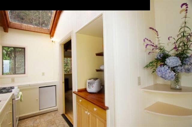 333 Middle Road Kula, HI 96790 - Photo 23 of 25 a bathroom with a granite countertop sink a toilet and mirror