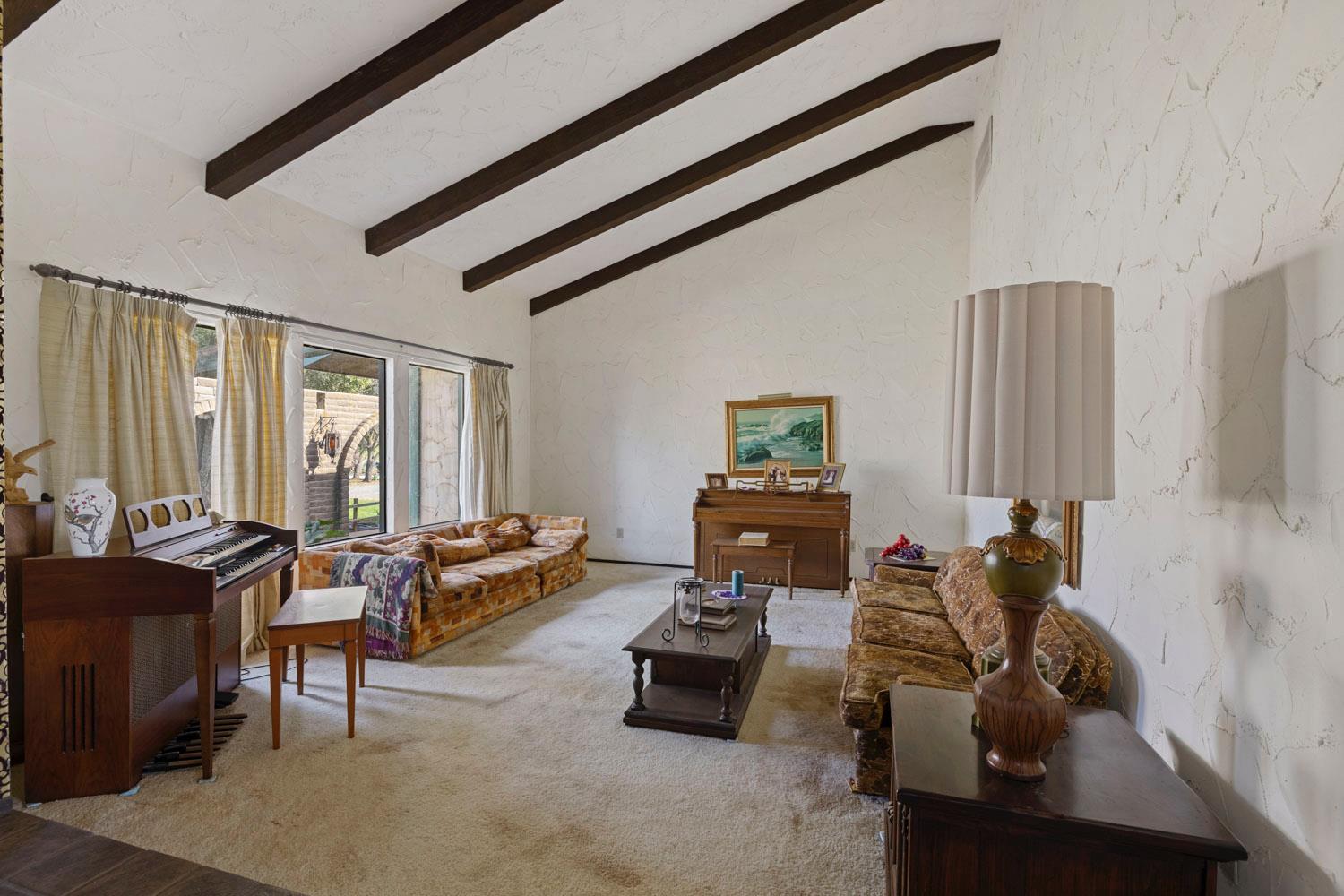 3270 Jackson Valley Road Ione, CA 95640 - Photo 13 of 34 a living room with furniture and floor to ceiling window