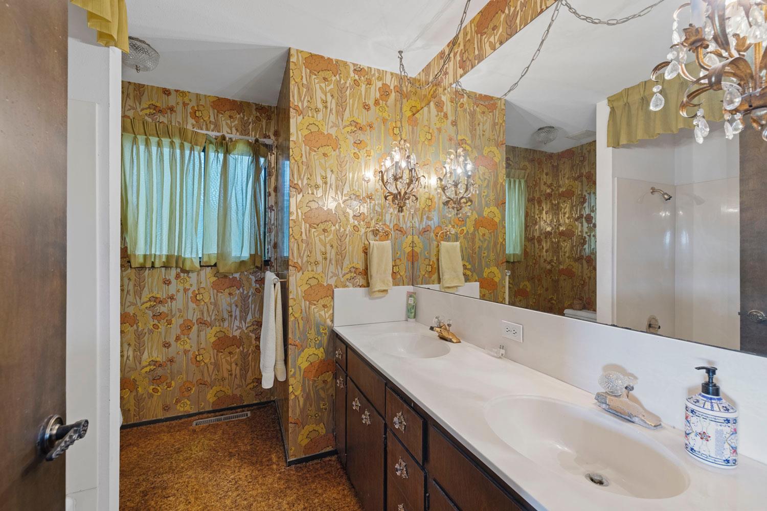 3270 Jackson Valley Road Ione, CA 95640 - Photo 16 of 34 a bathroom with a double vanity sink mirror and shower