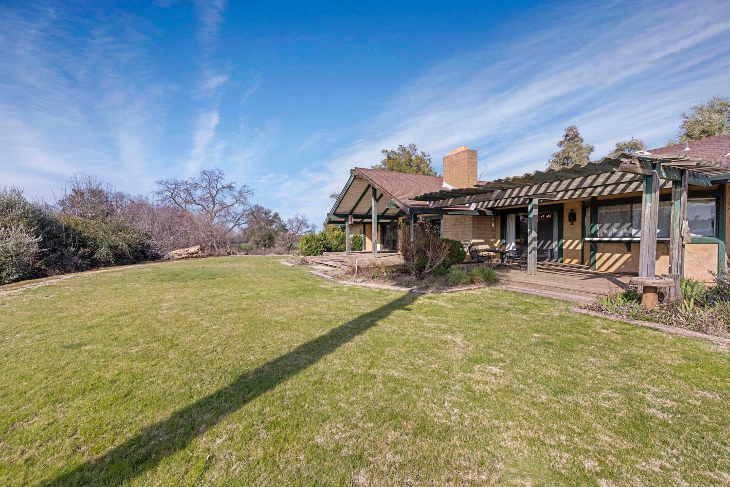 3270 Jackson Valley Road Ione, CA 95640 - Photo 4 of 34 a swimming pool with outdoor seating yard and mountain view