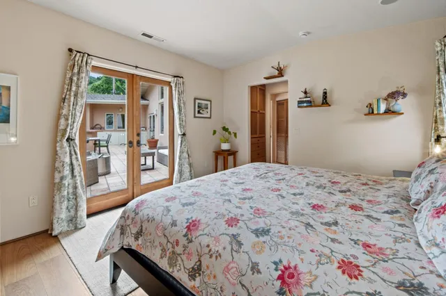 a bedroom with a bed and a dresser in it