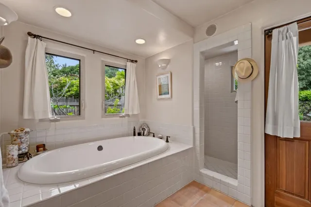 a bath tub sitting next to a window