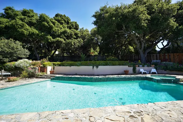 a view of a chair and table in the garden
