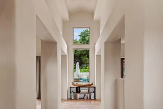 a view of a hallway with seating area