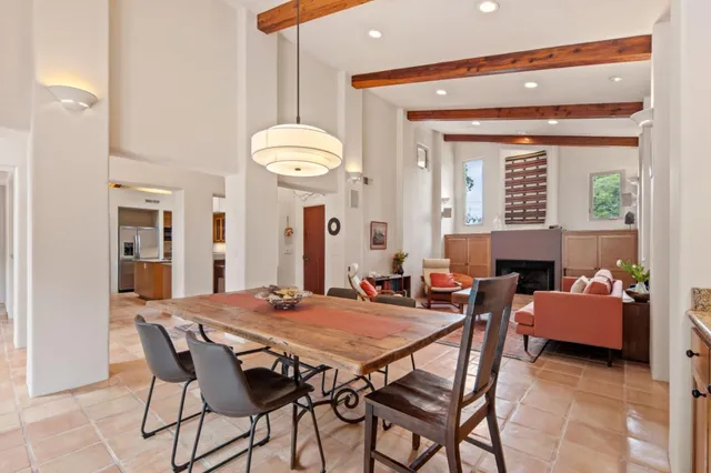 a view of a dining room with furniture and a large window