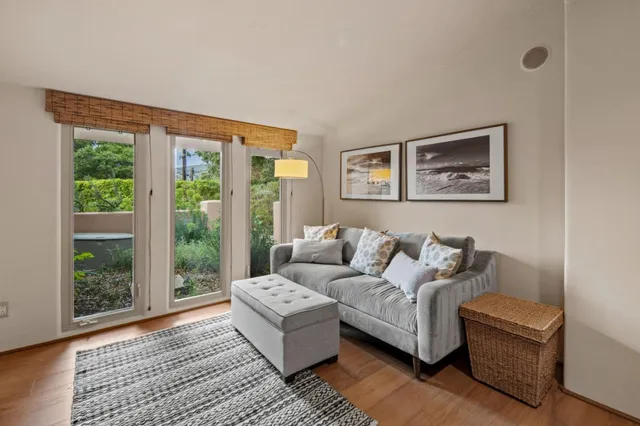 a living room with couch and a window