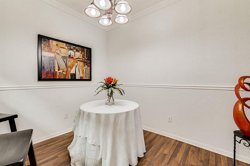 2100 Tanglewilde Street, Unit 296 Houston, TX 77063 - Photo 12 of 31 a view of a room with a table and chairs