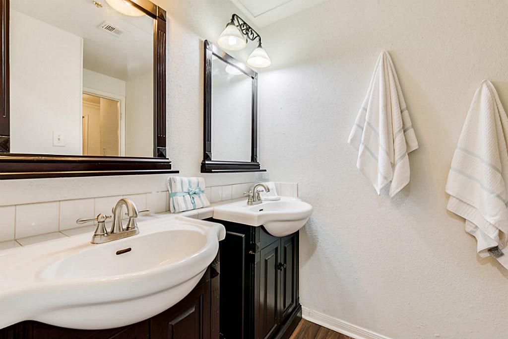 2100 Tanglewilde Street, Unit 296 Houston, TX 77063 - Photo 15 of 31 a bathroom with a sink and a mirror