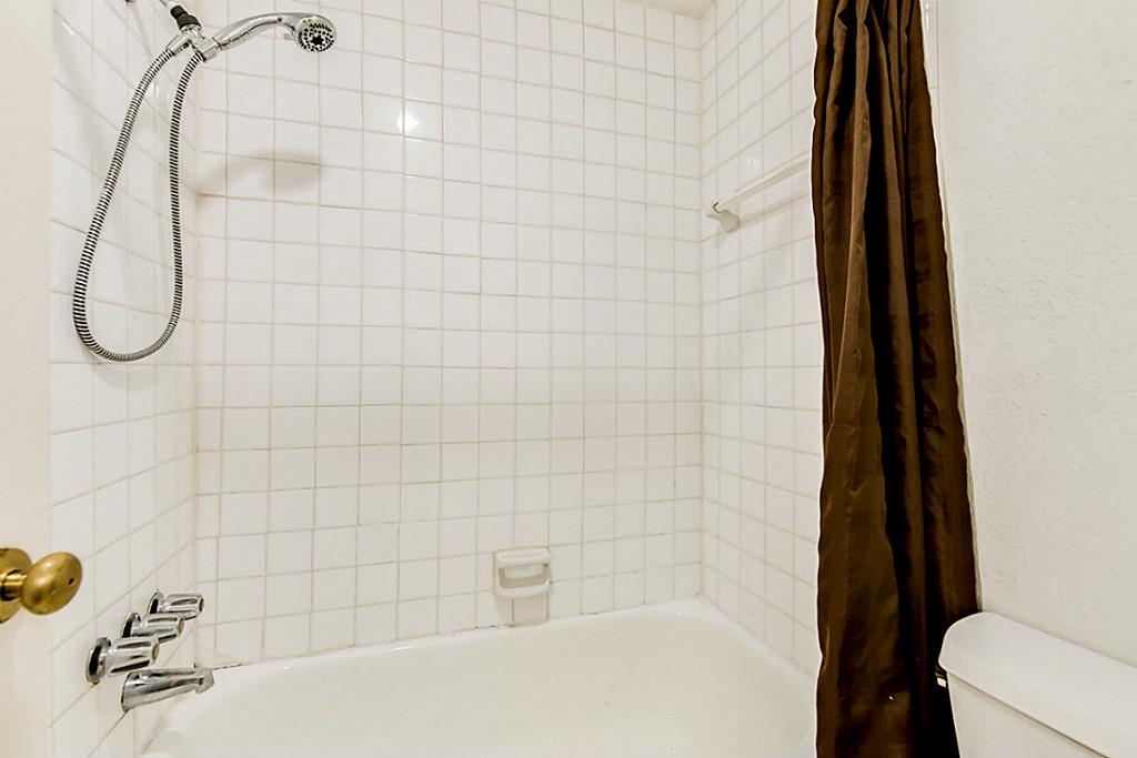 2100 Tanglewilde Street, Unit 296 Houston, TX 77063 - Photo 17 of 31 a bathroom with a shower
