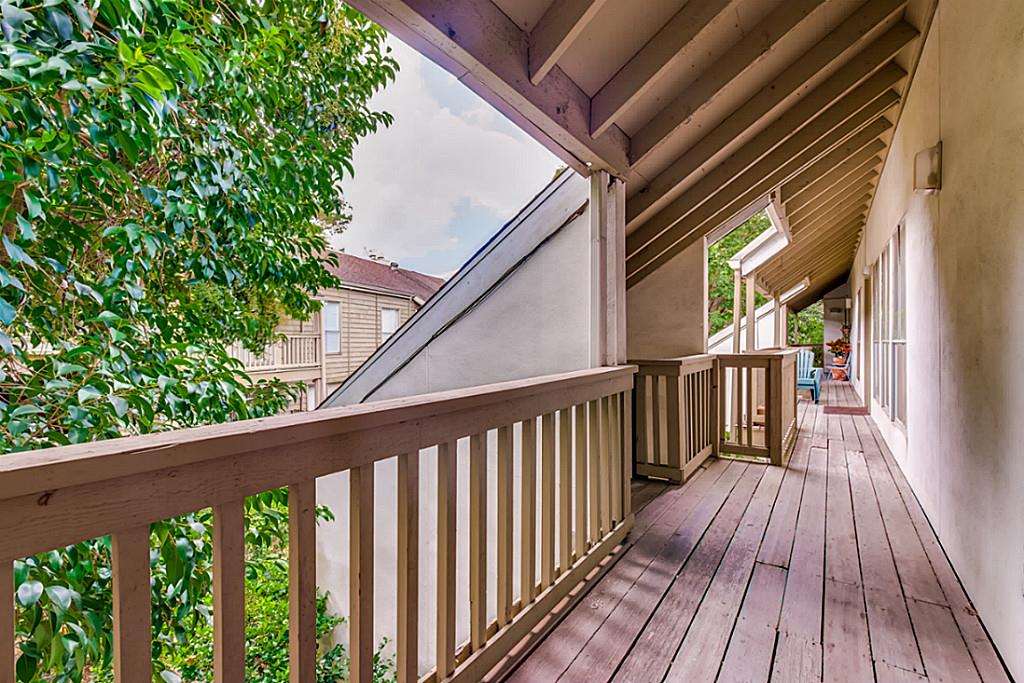 2100 Tanglewilde Street, Unit 296 Houston, TX 77063 - Photo 22 of 31 a view of a balcony with wooden floor