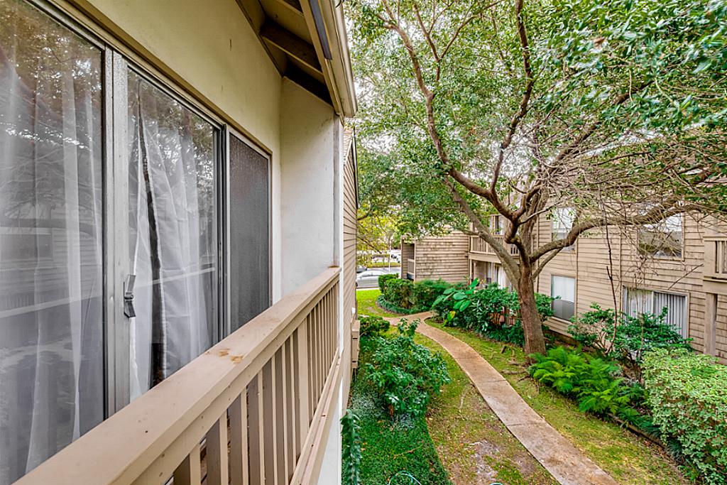 2100 Tanglewilde Street, Unit 296 Houston, TX 77063 - Photo 23 of 31 a view of a house with a tree in front of it