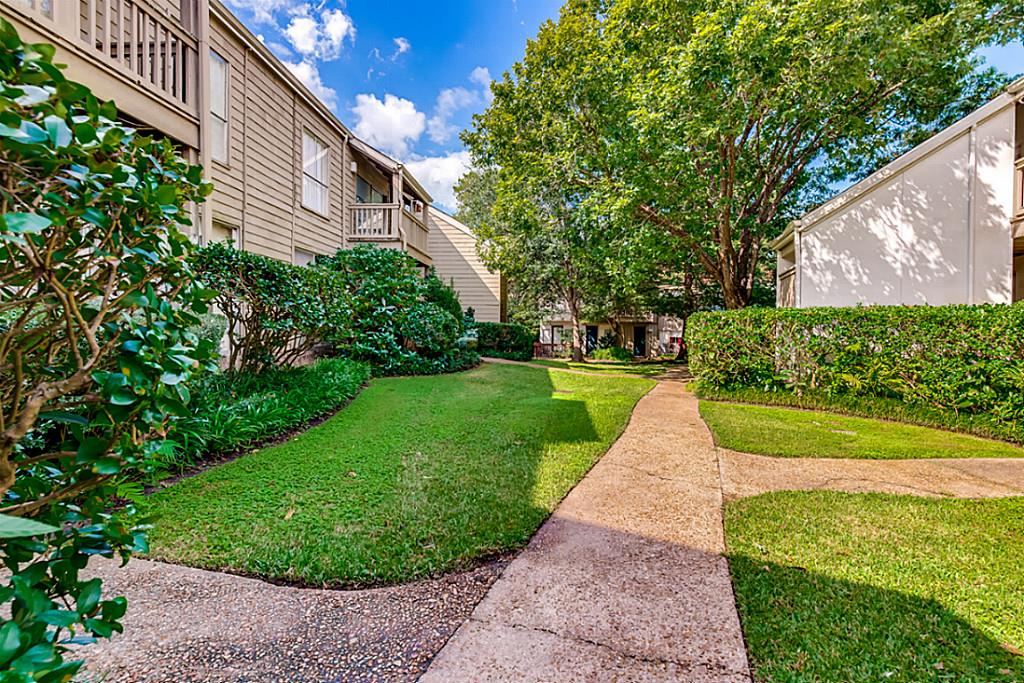 2100 Tanglewilde Street, Unit 296 Houston, TX 77063 - Photo 27 of 31 a view of a garden with a fountain