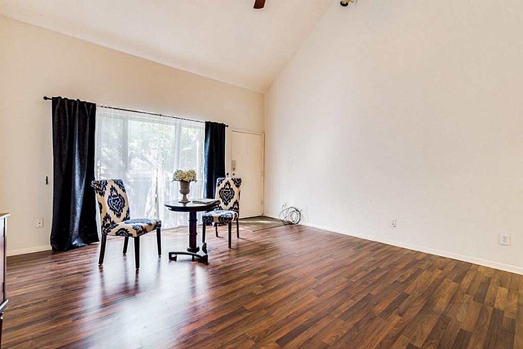 2100 Tanglewilde Street, Unit 296 Houston, TX 77063 - Photo 3 of 31 a view of a livingroom with furniture and wooden floor