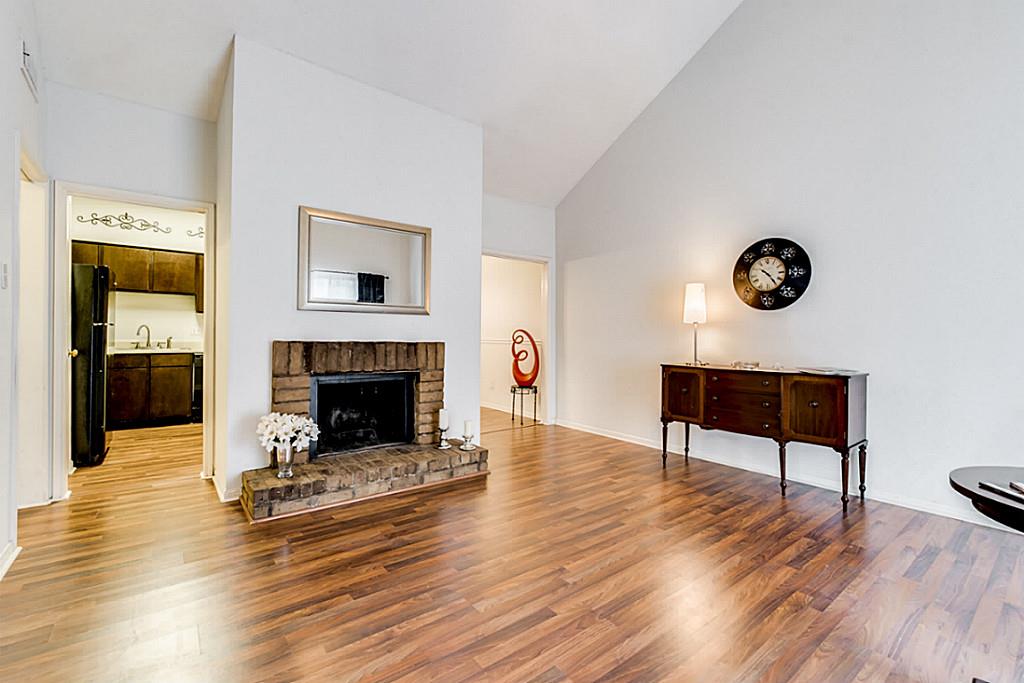 2100 Tanglewilde Street, Unit 296 Houston, TX 77063 - Photo 4 of 31 a living room with furniture and a fireplace