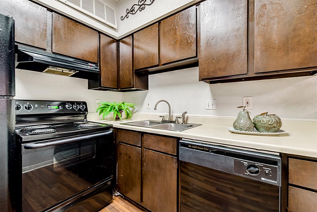 2100 Tanglewilde Street, Unit 296 Houston, TX 77063 - Photo 8 of 31 a kitchen with stainless steel appliances a sink stove and cabinets