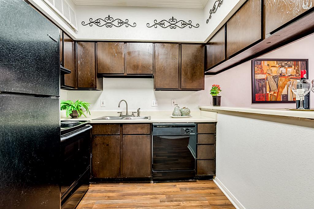 2100 Tanglewilde Street, Unit 296 Houston, TX 77063 - Photo 9 of 31 a kitchen with stainless steel appliances granite countertop a sink stove and cabinets