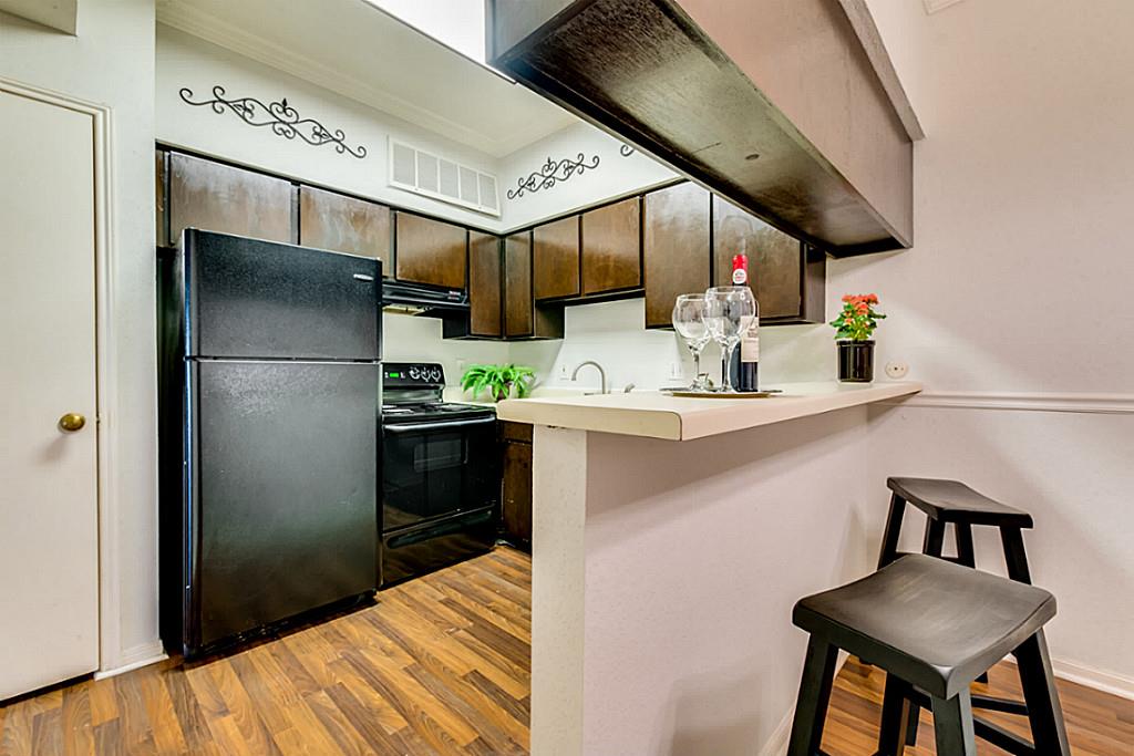 2100 Tanglewilde Street, Unit 296 Houston, TX 77063 - Photo 10 of 31 a kitchen with a refrigerator and a sink