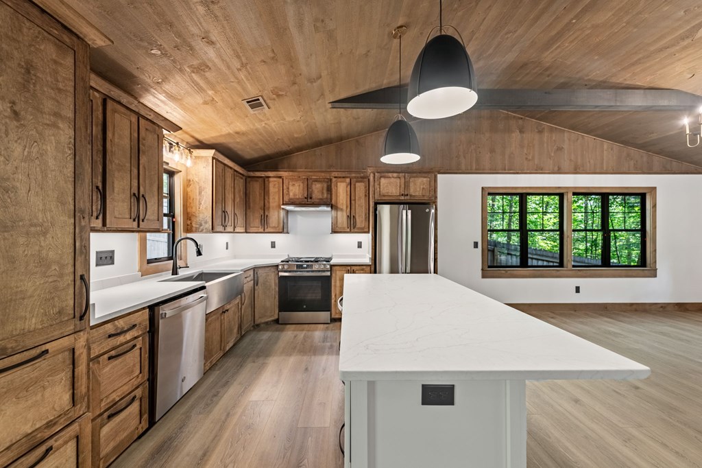 570 Cabin Trail Blue Ridge, GA 30513 - Photo 22 of 53 a large kitchen with a large window and stainless steel appliances