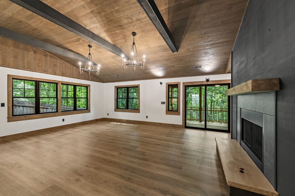 570 Cabin Trail Blue Ridge, GA 30513 - Photo 26 of 53 a view of an empty room with wooden floor and a window
