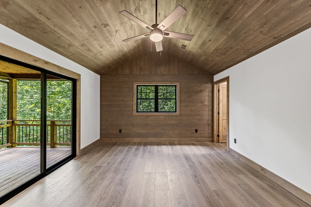 570 Cabin Trail Blue Ridge, GA 30513 - Photo 30 of 53 a view of empty room with wooden floor and fan